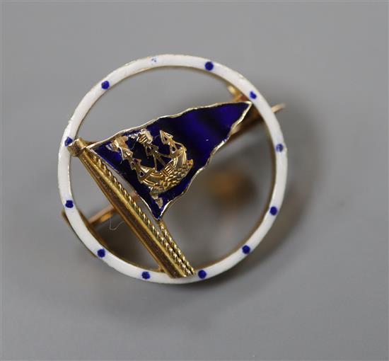 A 1950s 9ct gold and enamel set openwork circular pennant brooch, retailed by Benzies in Cowes, 22mm, gross 4.7 grams.